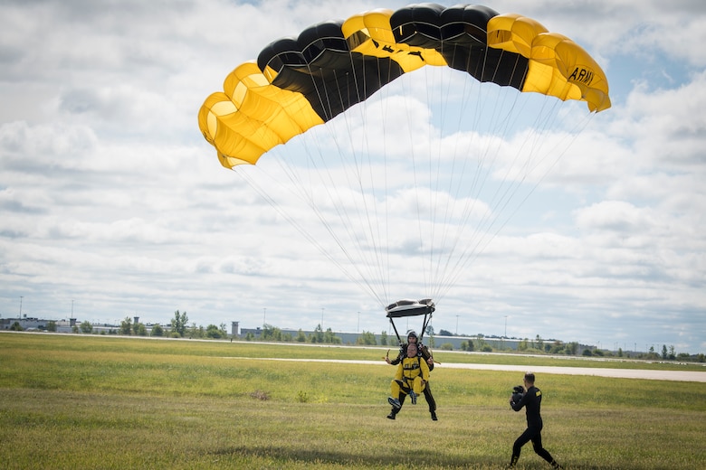 Col. Larry Shaw, 434th Air Refueling Wing commander, completes a tandem parachute jump with Sgt. First Class Jared Zell, U.S. Army Golden Knights, to open up the 2019 Grissom Air & Space Expo, Sept. 7, 2019. The event drew thousands of spectators, and will continue Sept. 8, 2019 as gates open at 8:30 a.m. with flying starting around 11 a.m. and gates closing at 5 p.m. to the free event. (U.S. Air Force photo/Master Sgt. Benjamin Mota)