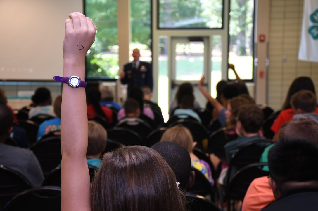 Youth ask questions of Maj. Benjamin Calhoon, 22nd Air Force executive officer, regarding his experience as a space operations officer at Rock Eagle 4-H Center in Eatonton, Ga., Aug 17, 2019. Maj. Calhoon served as capnote speaker for the event and shared opportunities for STEM related careers and space-related technology in the Air Force.