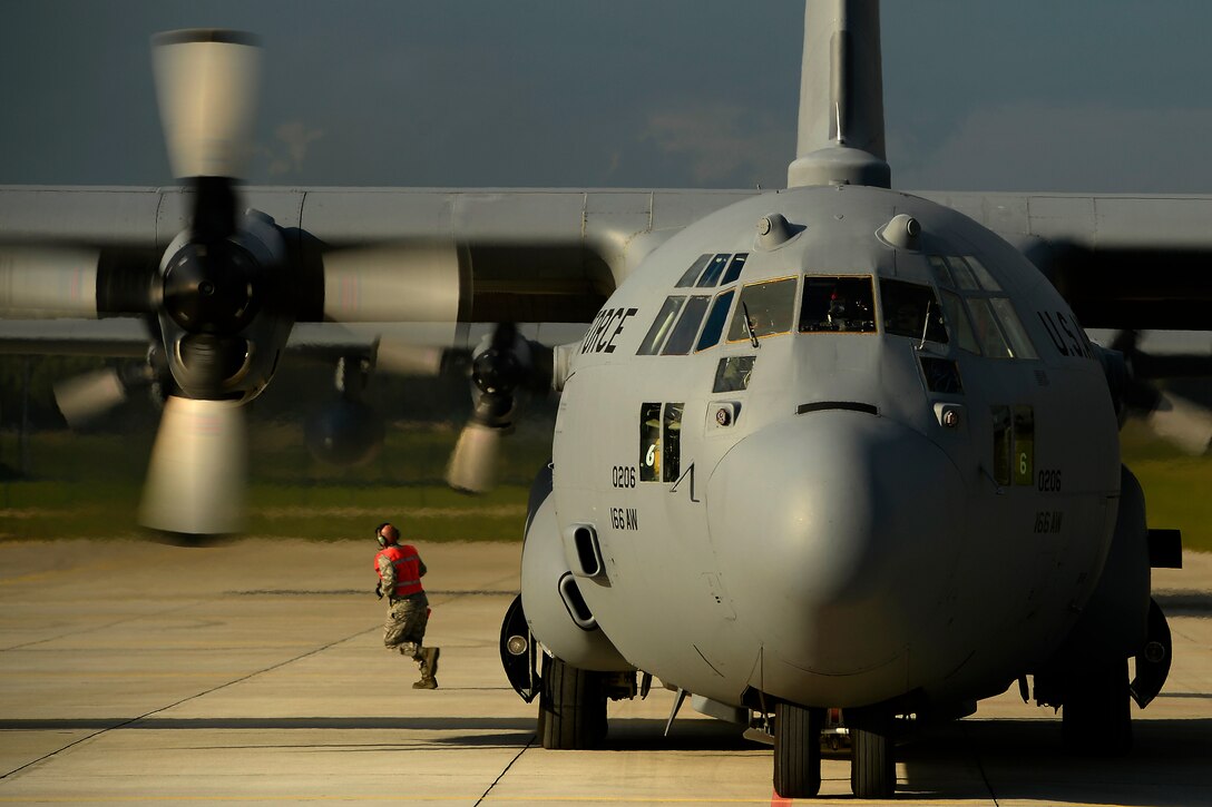 A U.S. Air Force C-130H Hercules aircraft assigned to the 142nd Airlift Squadron, Delaware Air National Guard is on the flight line at Lielvarde Air Base, Latvia, as U.S. Soldiers assigned to the 173rd Airborne Brigade Combat Team prepare to depart from the base Sept. 7, 2014, during exercise Steadfast Javelin II. Steadfast Javelin II is a NATO-led exercise designed to prepare U.S., NATO and international partner forces for unified land operations. (DoD photo by Staff Sgt. Tim Chacon, U.S. Air Force/Released)