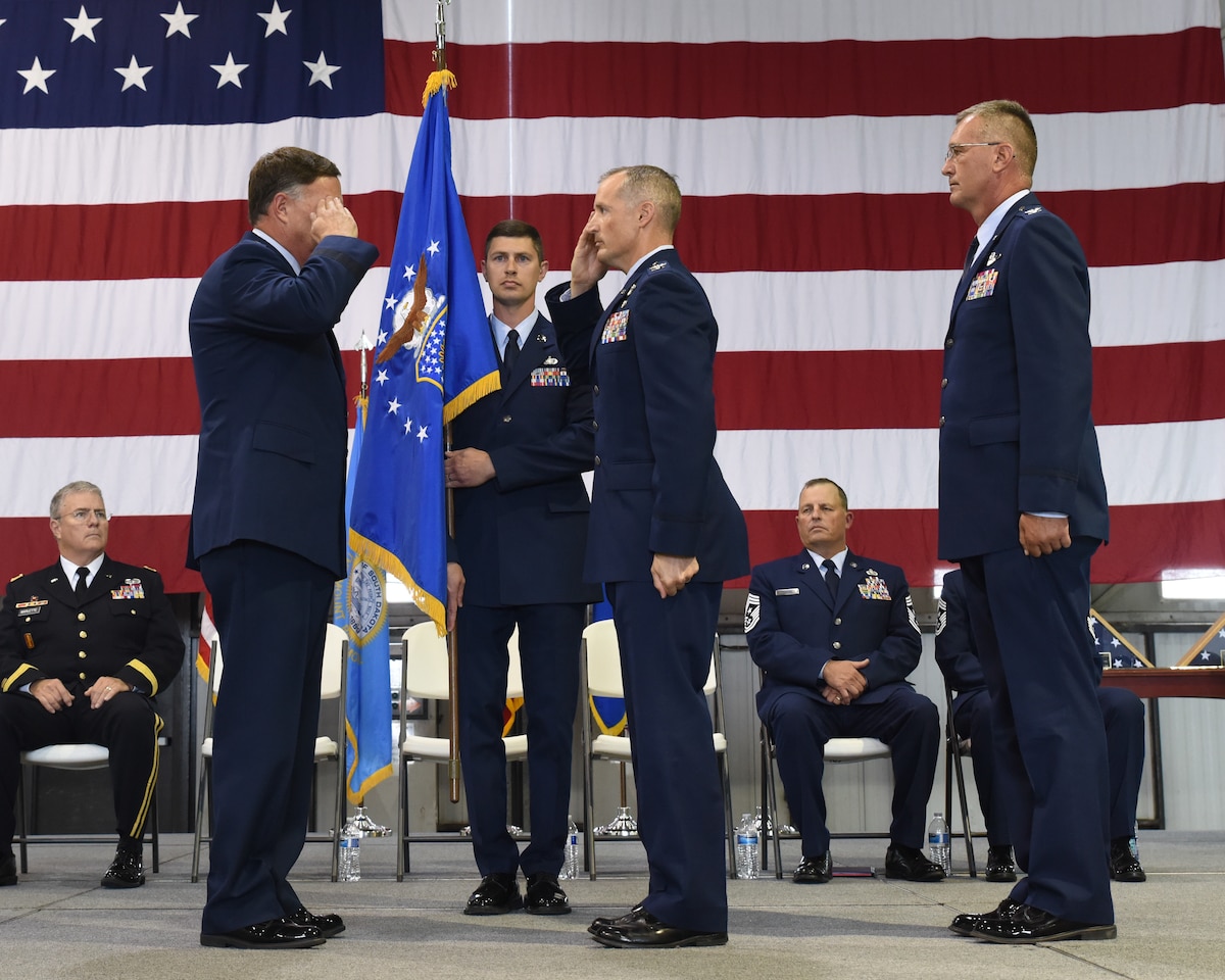 Col. Mark R. Morrell, 114th Fighter Wing incoming commander, salutes Brig. Gen. Russ A. Walz, Assistant Adjutant General for air, South Dakota Air National Guard, during the 114th Fighter Wing Change of Command Ceremony at Joe Foss Field, S.D. Sept. 7, 2019.