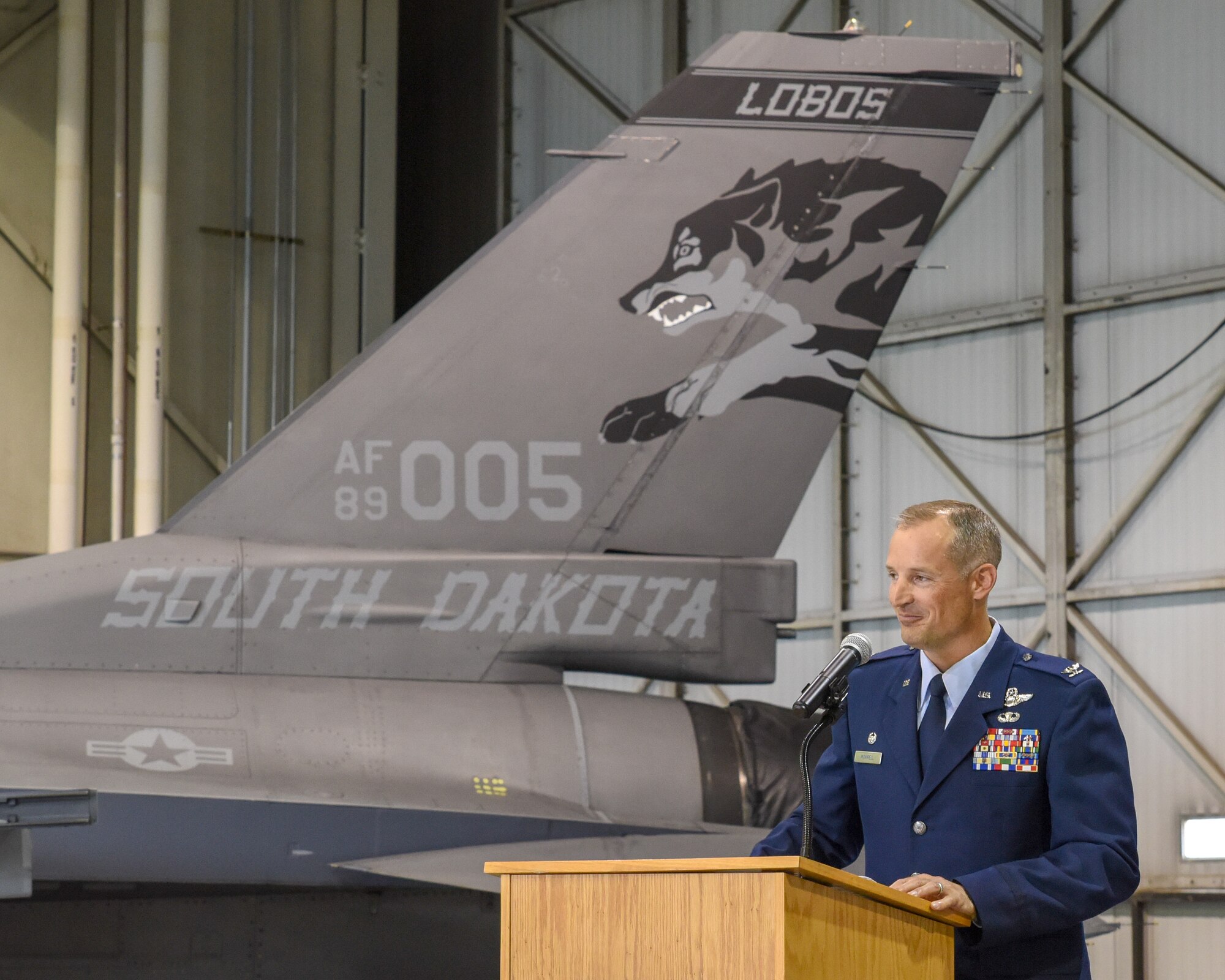 Col. Mark R. Morrell addresses 114th Fighter Wing Airmen, family and friends during a commander’s call after he assumed his new role as the 114th FW commander at Joe Foss Field, Sept. 7.