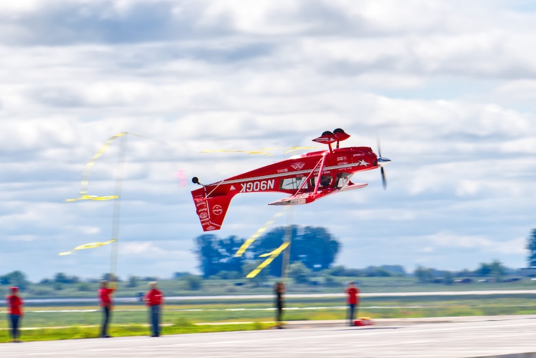 An American Champion 8KCAB Decathlon performs aerial acrobatics in front of an audience at the 2019 Grissom Air & Space Expo. With an estimated crowd of over 50,000, it was Grissom's first air show in over 15 years.