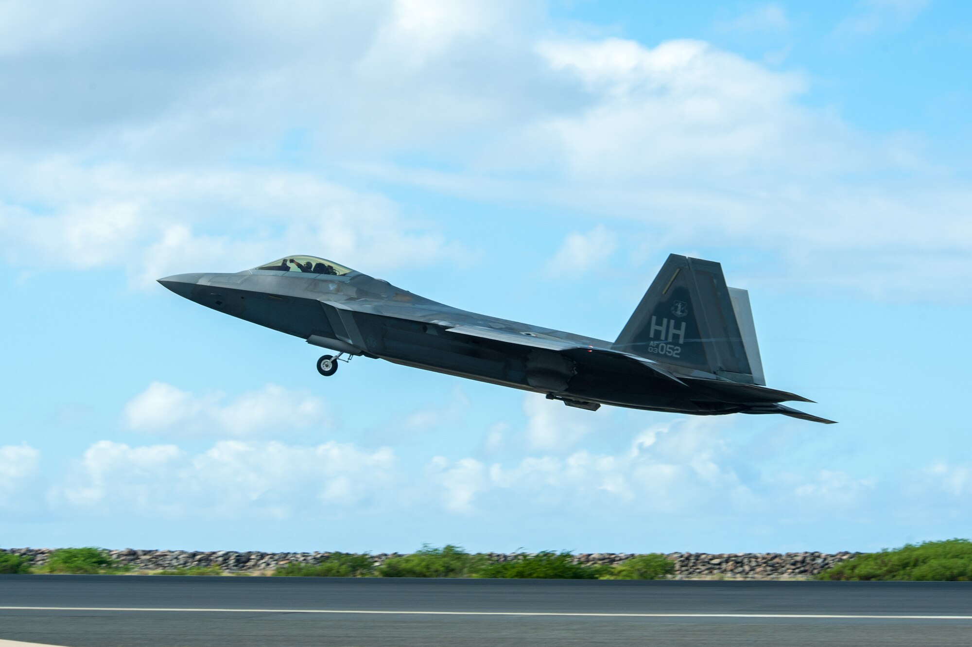 A Hawaii Air National Guard F-22 Raptor takes off at Joint Base Pearl Harbor-Hickam, Hawaii, Aug. 21, 2019 during fighter exercise Sentry Aloha 19-2.