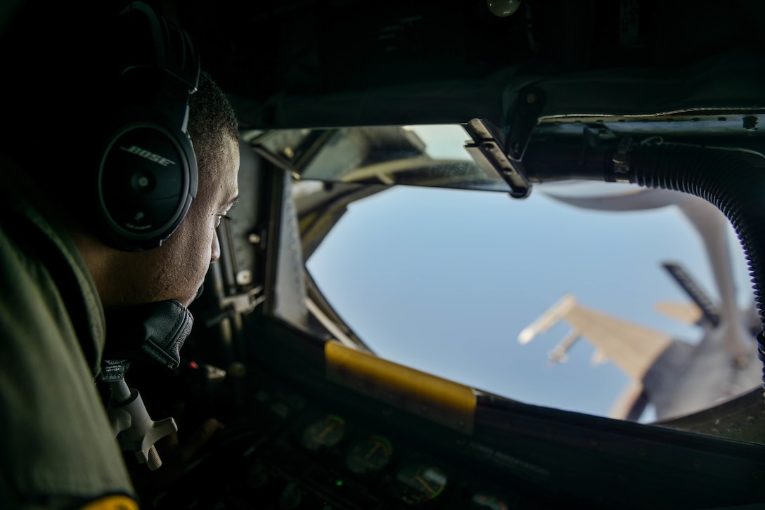 U.S. Air Force Technical Sergeant Shane Williams, 203rd Air Refueling Squadron Boom Operator, refuels a F-16 Fighting Falcon from Tulsa Air National Guard Base in Tulsa, Oklahoma, during the Sentry Aloha exercise at Joint Base Pearl Harbor-Hickam, August 27, 2019.