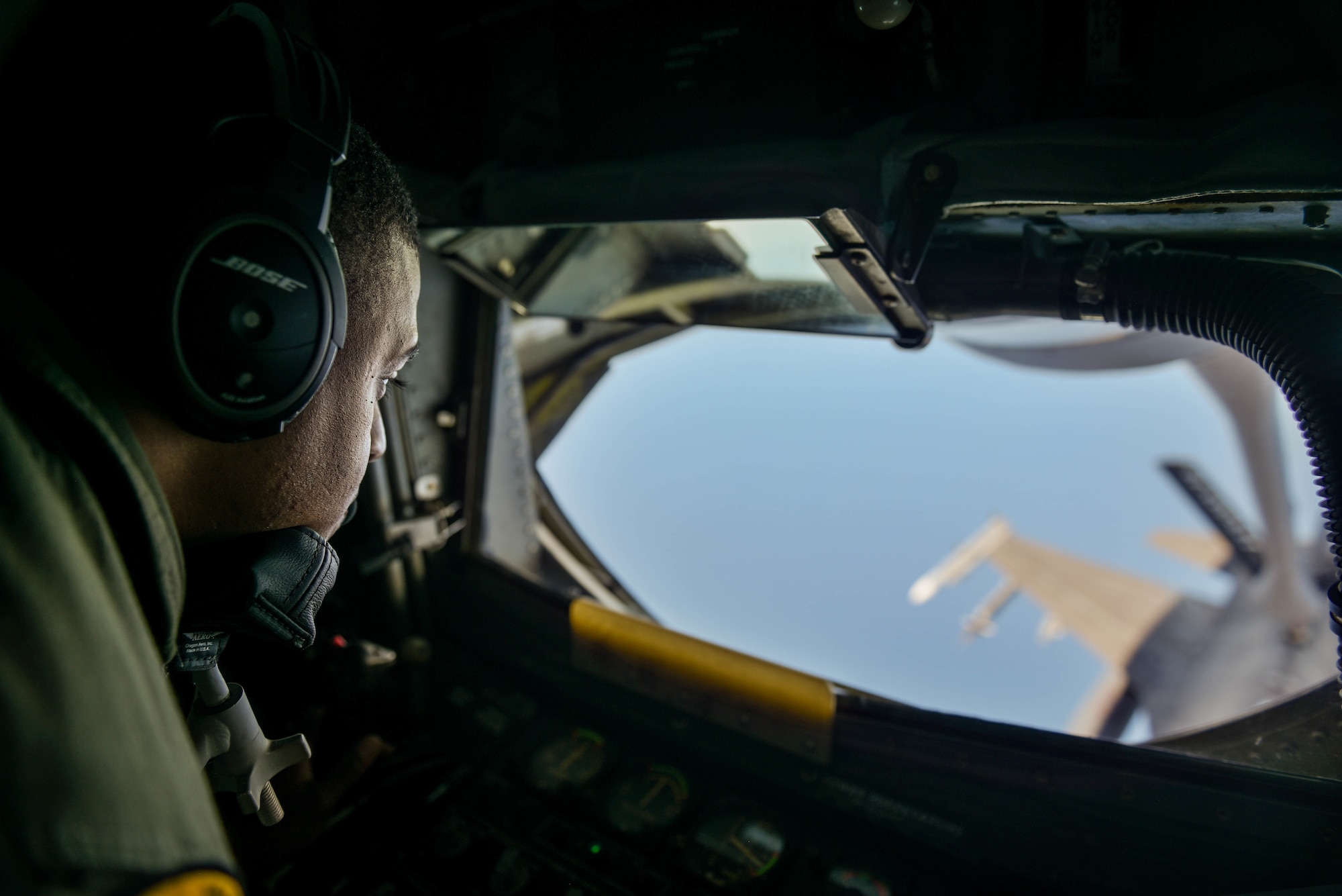 U.S. Air Force Technical Sergeant Shane Williams, 203rd Air Refueling Squadron Boom Operator, refuels a F-16 Fighting Falcon from Tulsa Air National Guard Base in Tulsa, Oklahoma, during the Sentry Aloha exercise at Joint Base Pearl Harbor-Hickam, August 27, 2019.