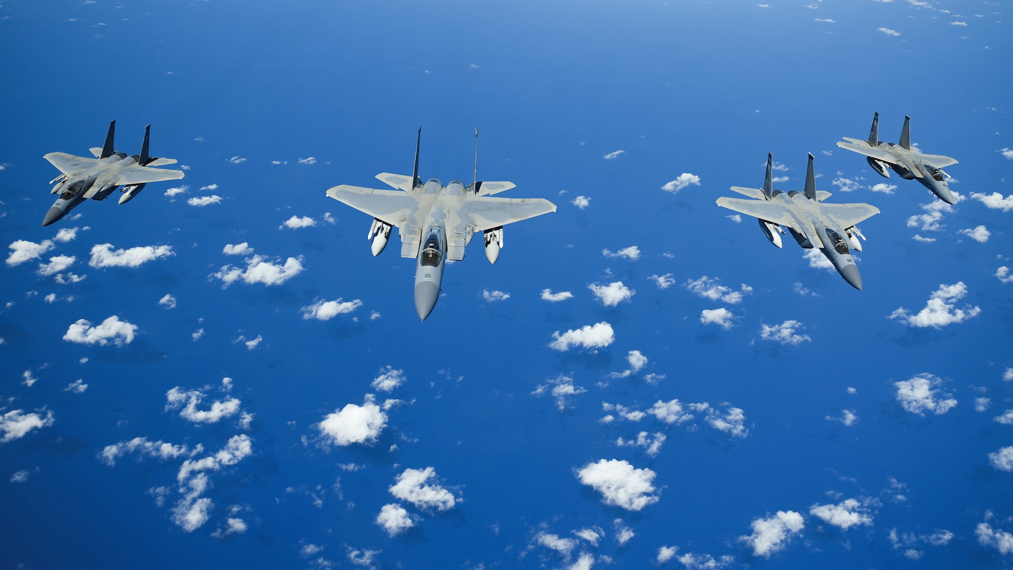 United States Air Force F-15 Eagles from the 173rd Fighter Wing out of Kingsley Field in Klamath Falls, Oregon, fly in formation over the Pacific Ocean during the Sentry Aloha exercise at Joint Base Pearl Harbor-Hickam, August 27, 2019.