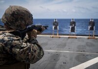 Cpl. Joel Castro, a heavy equipment mechanic with Golf Company, Battalion Landing Team, 2nd Battalion, 1st Marines, 31st Marine Expeditionary Unit, fires a Mossberg 500 shotgun during a live-fire range aboard the dock landing ship USS Ashland (LSD 48), Philippine Sea, Aug. 6, 2019. Ashland, part of the Wasp Amphibious Ready Group, with embarked 31st MEU, is operating in the Indo-Pacific region to enhance interoperability with partners and serve as ready-response force for any type of contingency, while simultaneously providing a flexible and lethal crisis response force ready to perform a wide range of military operations. (Official U.S. Marine Corps photo by Cpl. Brennan Priest)