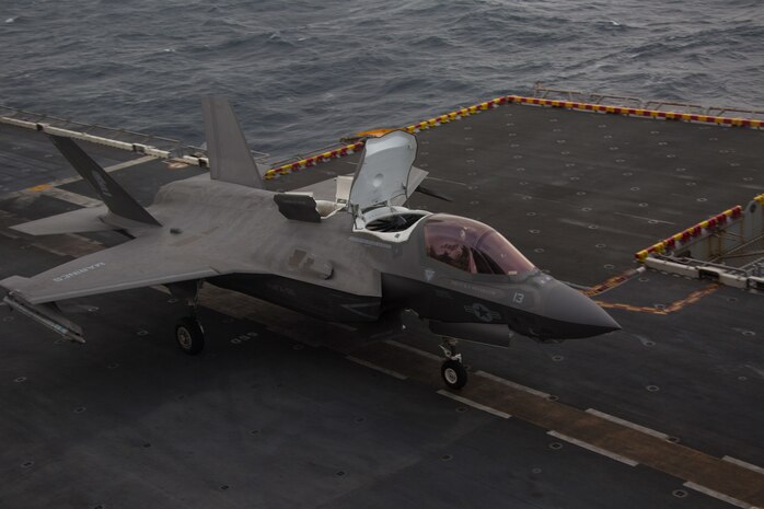 An F-35B Lightning II fighter aircraft with Marine Medium Tiltrotor Squadron 265 (Reinforced), 31st Marine Expeditionary Unit, loaded with a Joint Direct Attack Munition and a laser guided bomb, prepares to take off during an aerial gunnery and ordnance hot-reloading exercise aboard the amphibious assault ship USS Wasp (LHD 1), Solomon Sea, August 4, 2019. Wasp, flagship of the Wasp Amphibious Ready Group, with embarked 31st MEU, is operating in the Indo-Pacific region to enhance interoperability with partners and serve as ready-response force for any type of contingency, while simultaneously providing a flexible and lethal crisis response force ready to perform a wide range of military operations. (U.S. Marine Corps photo by Lance Cpl. Dylan Hess)