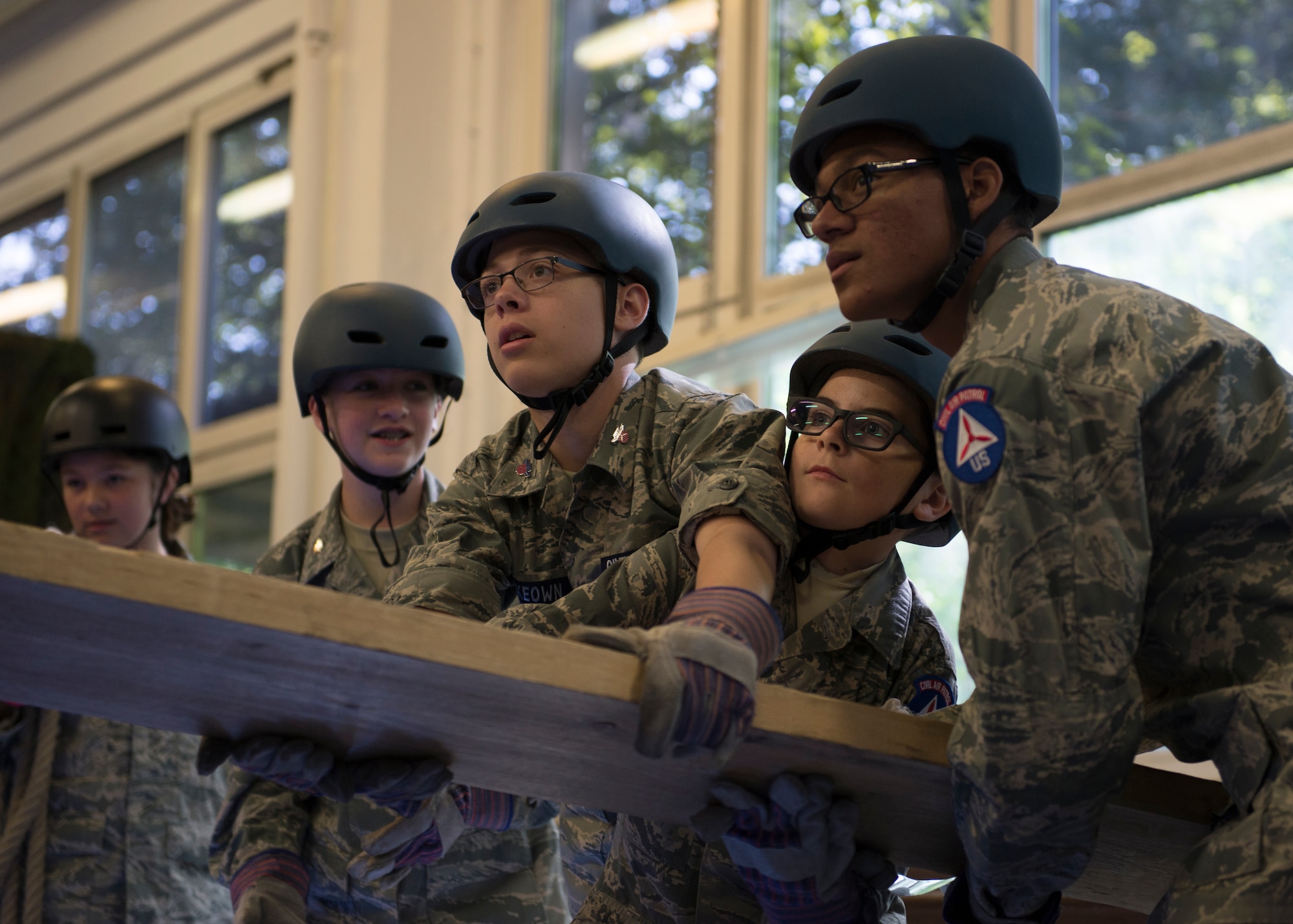 U.S. Civil Air Patrol cadets work together to balance a plank of wood during a team-building activity August 1, 2019, at Kapaun Air Station, Germany. The 2019 European Summer Encampment is the largest overseas encampment held so far, hosting cadet Airmen from states such as Alaska to countries such as the United Kingdom.