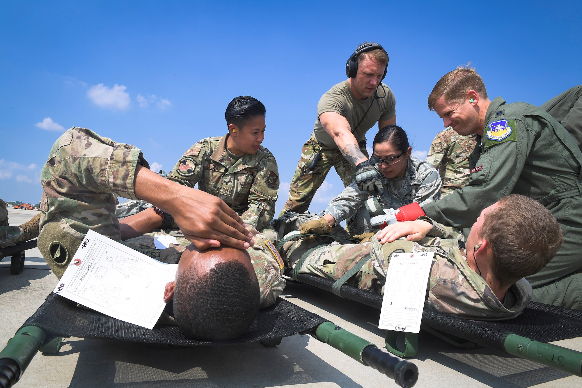 Team Osan members prepare to transport injured Army patients during Operation Ascending Eagle, Aug. 28, 2019, at Osan Air Base, Republic of Korea. Air Force and Army medics jointly operated in the simulated large casualty training to enhance their aeromedical evacuation and patient transportation procedures. (U.S. Air Force photo by Staff Sgt. Greg Nash)