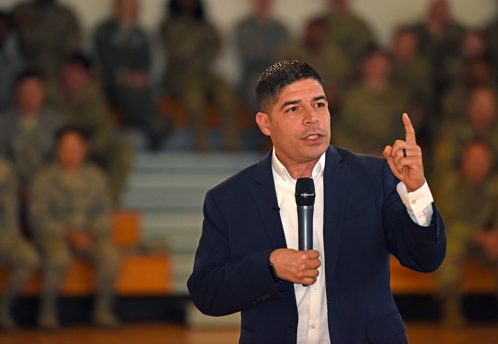 Retired U.S. Army Capt. John Arroyo addresses Airmen of the 100th Air Refueling Wing during a wing-wide all call addressing suicide awareness at RAF Mildenhall, England, Sept. 5, 2019. Arroyo, a former Green Beret, survived a mass shooting on Fort Hood, Texas, and travels the globe to share his message of second chances. Arroyo regularly pulls from his experiences of addictions, failure and disappointment and entwines a message of resiliency, courage and survival. (U.S. Air Force photo by Airman 1st Class Brandon Esau)