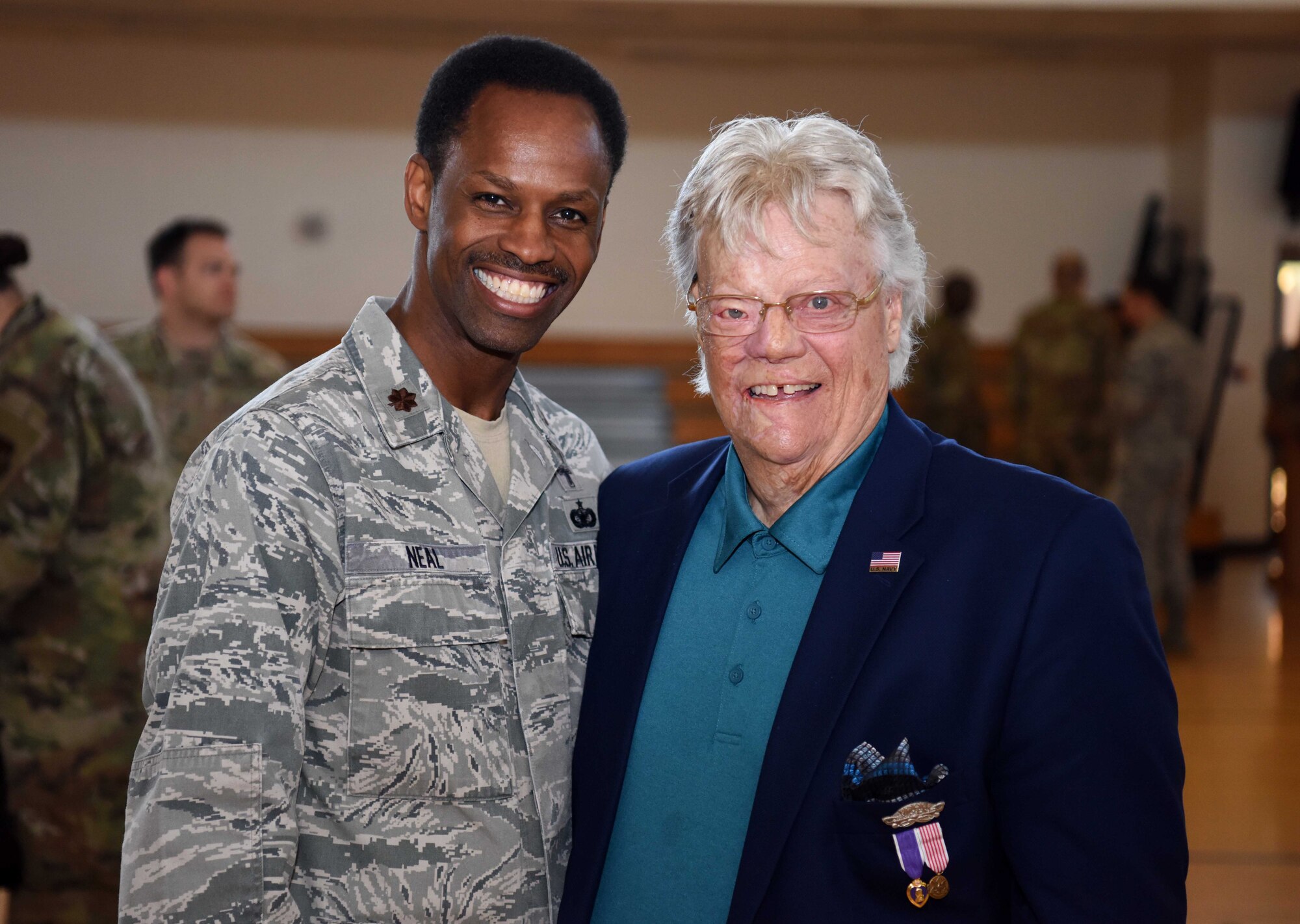 Chaplain (Maj.) Kennie Neal, 100th Air Refueling Wing chaplain, poses for a photo with Dave Roever, Vietnam War veteran and Purple Heart recipient, after a wing-wide all call addressing suicide awareness at RAF Mildenhall, England, Sept. 5, 2019. Roever presented a message of integrated resiliency and suicide prevention to 100th ARW Airmen. (U.S. Air Force photo by Airman 1st Class Brandon Esau)