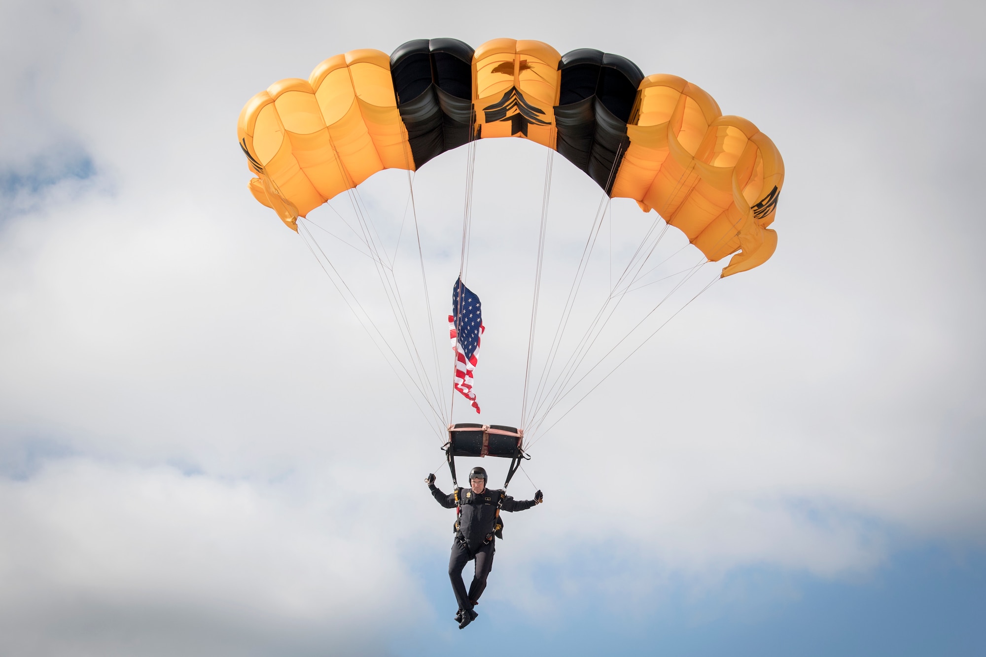 Sgt. 1st Class Derrick Coleman, U.S. Army Golden Knights parachute team member, lands during a demonstration at  Grissom Air & Space Expo, Grissom Air Reserve Base, Indiana Sept. 7, 2019. The Golden Knights kicked off the event with the American flag and the National Anthem. (U.S. Air Force photo/Master Sgt. Benjamin Mota)