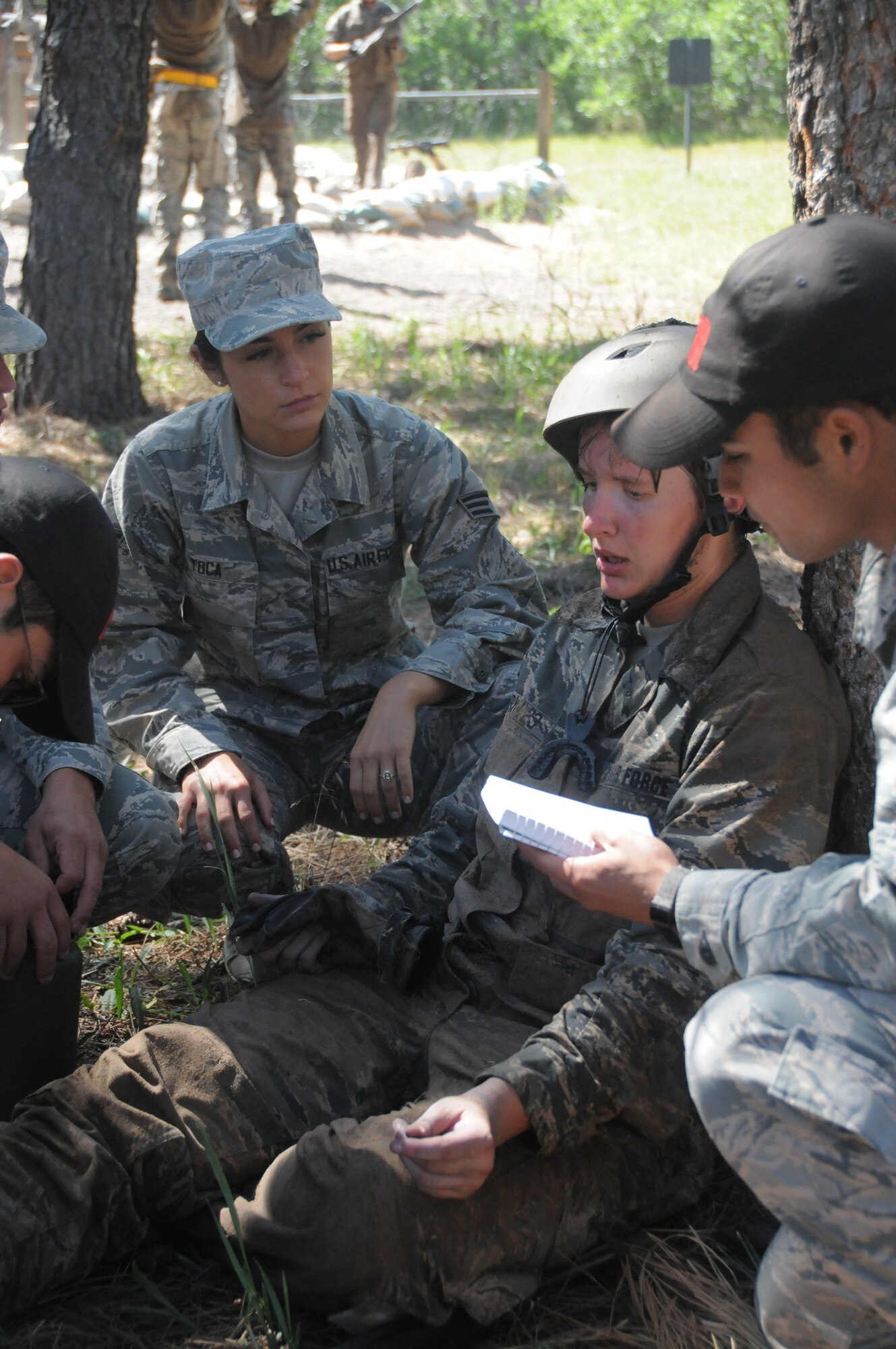 Senior Airman Alissa Toca (far left),a 445th Aeromedical Staging Squadron aerospace medical technician, provides technical supervision and support to U.S. Air Force Academy cadets during a field training event at the Air Force Academy, Colorado Springs, July 23, 2019.