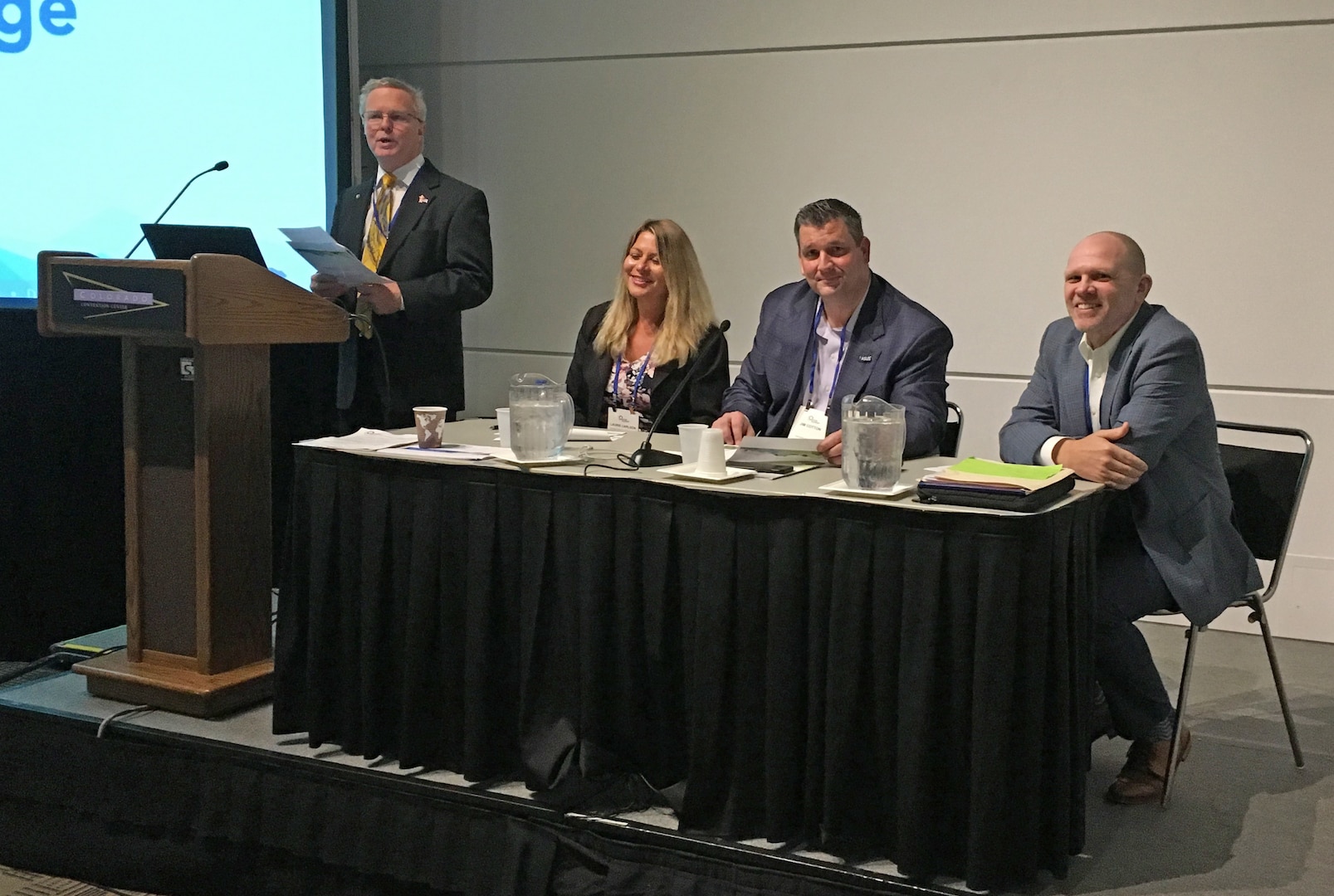 a panel of leaders speak to group