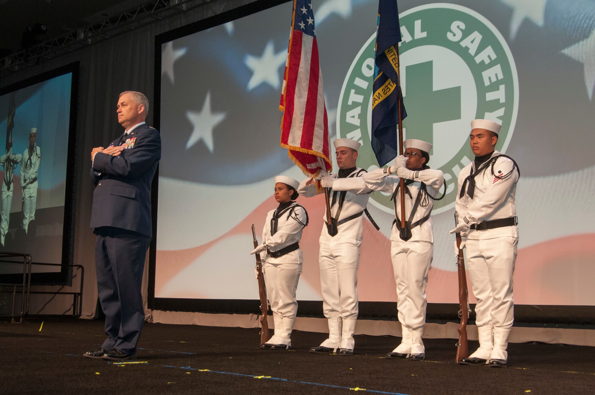 Col. William Culver, Air Force Safety Center's deputy commander, stands ready to present a flag to 9/11 survivor during the opening ceremonies of the National Safety Council's 2019 Congress & Expo held in San Diego, California, Sept. 6-11.