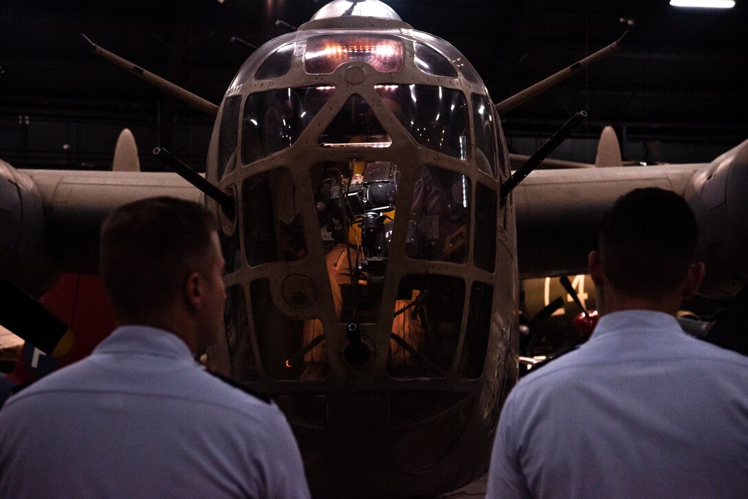 Airmen from F.E. Warren Air Force Base, Wyo., look upon the B-24D nicknamed "Strawberry Bitch", during a tour of The National Museum of the U.S. Air Force Sept. 4, 2019, at Wright-Patterson Air Force Base, Ohio. The purpose of the visit was to allow Airmen learn about the history of Air Force aircrafts and the teamwork behind their missions. (U.S. Air Force photo by Senior Airman Abbigayle Williams)