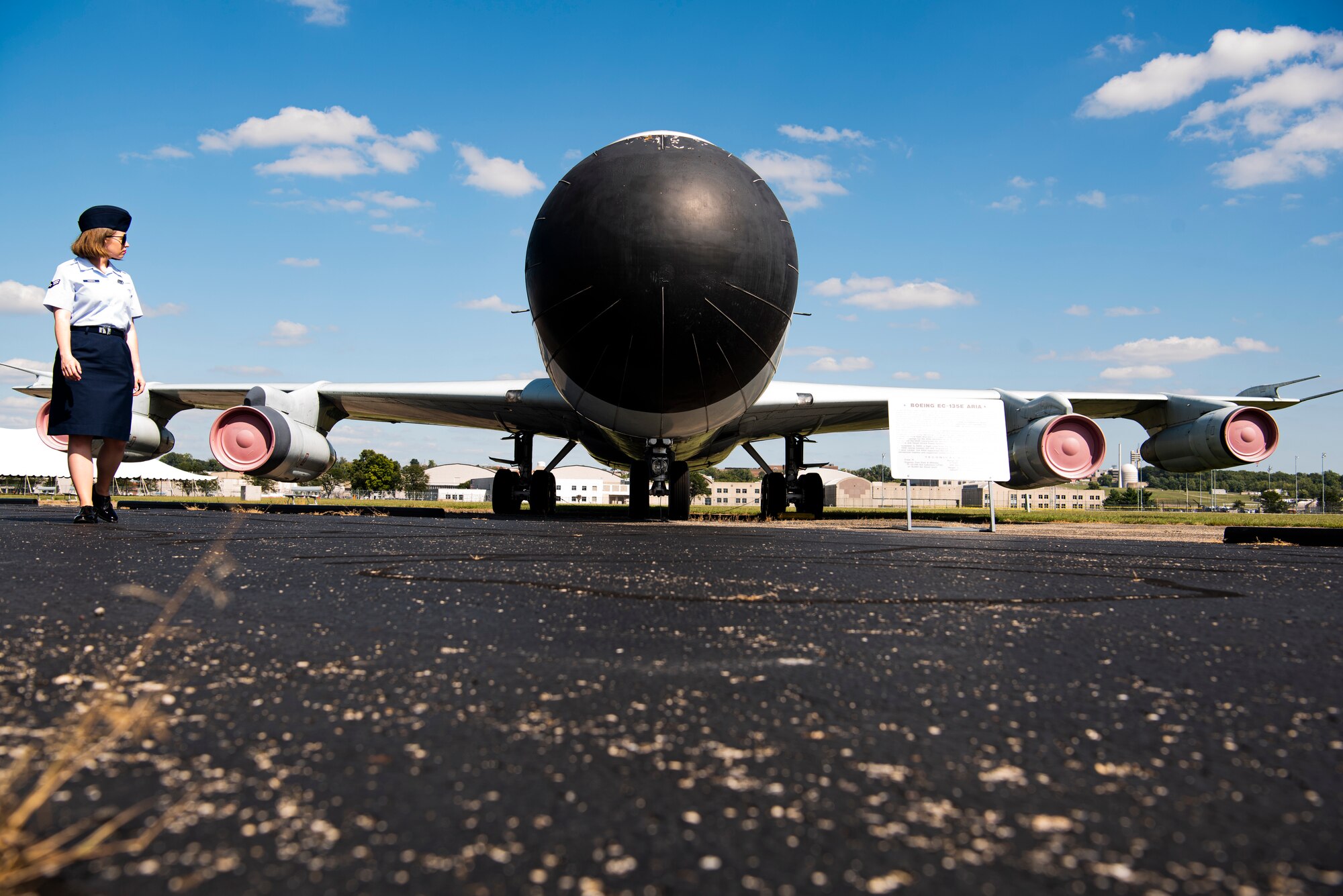 Airman 1st Class Brittany Parsons, 90th Comptroller Squadron financial operations technician, looks back on the EC-135E ARIA (Boeing) during a tour of the air park at National Museum of the U.S. Air Force Sept. 4, 2019, at Wright-Patterson Air Force Base, Ohio. A group of Airmen from F.E. Warren Air Force Base, Wyo., took a heritage trip to the museum to learn about teamwork throughout ICBM history. (U.S. Air Force photo by Senior Airman Abbigayle Williams