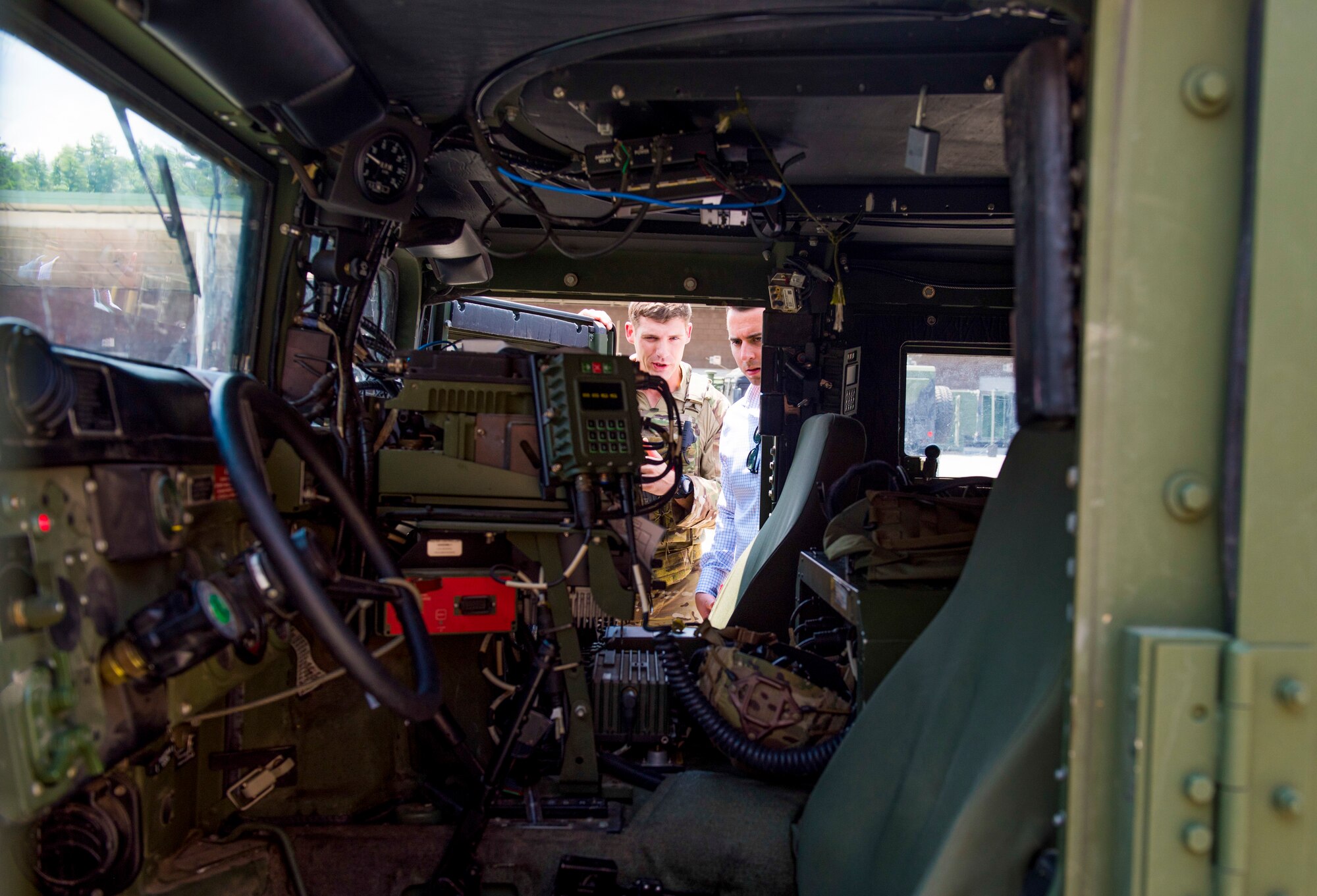 A U.S. Air Force joint terminal attack controller, assigned to the 165th Air Support Squadron, Georgia Air National Guard, performs a sound check while giving a presentation of their communication system installed in their Humvee called a Battlefield Airman System of Integrated Communications (BASIC) in Savannah, Ga. on August 13, 2019. The BASIC allows JTAC airmen to establish communications on multiple frequencies including HF, UHF, VHF, FM and SATCOM radios all while being protected from harsh conditions in an armored vehicle following a natural disaster. (U.S. Air National Guard photo by Staff Sgt. Caila Arahood)