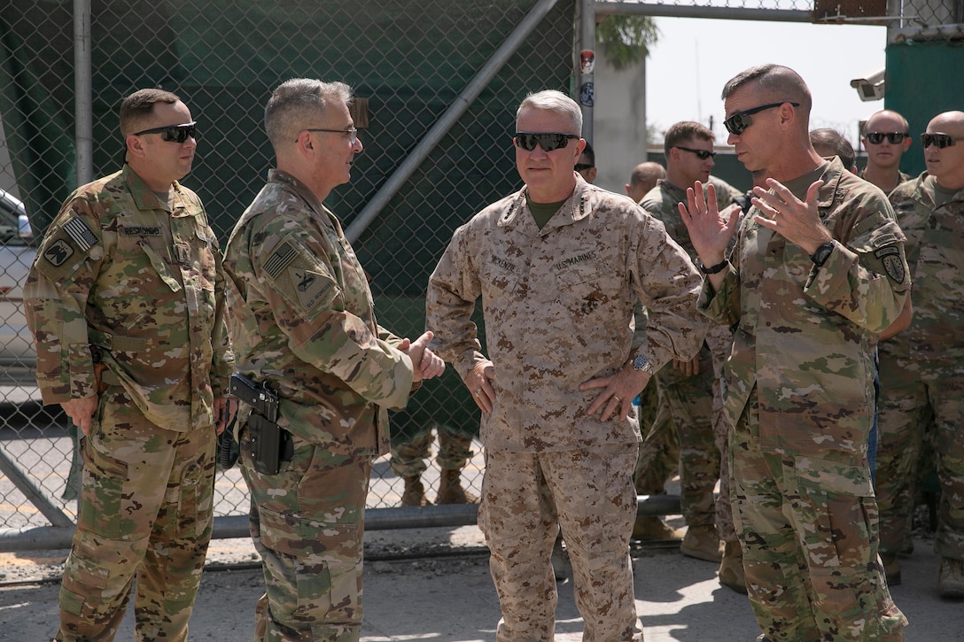 U.S. Army Brig. Gen. Donn H. Hill, far right, the commander of Train Advise Assist Command – East, speaks with U.S. Marine Corps Gen. Kenneth F. McKenzie, center right, the commander of U.S. Central Command, during McKenzie’s visit in Jalalabad, Afghanistan, Sept. 9, 2019. (U.S. Marine Corps photo by Sgt. Roderick Jacquote)