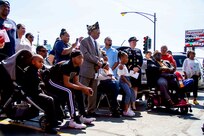 Immediate and extended members of the Robinson family listen to keynote speakers during the dedication ceremony of the Sgt. Simone A. Robinson Women Veteran’s Center on Sept. 7