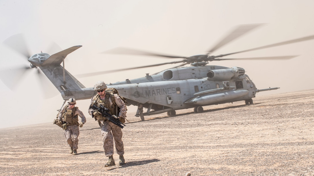 U.S. Marines depart a CH-53E Super Stallion during an aerial raid exercise in Wadi Shadiya, Jordan, Sept. 4.