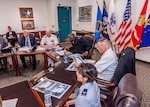 Lt. Gen. Darrell Williams sits at a table with leadership