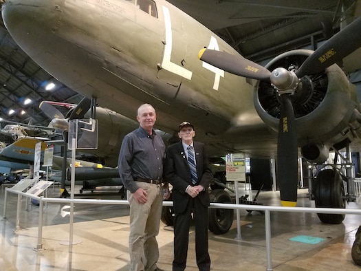 Air Force Research Laboratory Aerospace Systems Directorate employee Kevin Price (left) and World War II veteran Jim “Pee Wee” Martin look over the C-47 aircraft displayed at the National Museum of the United States Air Force on August 30, 2019. Price will accompany the 98-year-old Martin in September as he travels to the Netherlands to parachute into the region he helped liberate 75 years ago as part of Operation Market Garden. (U.S. Air Force Photo/Holly Jordan)