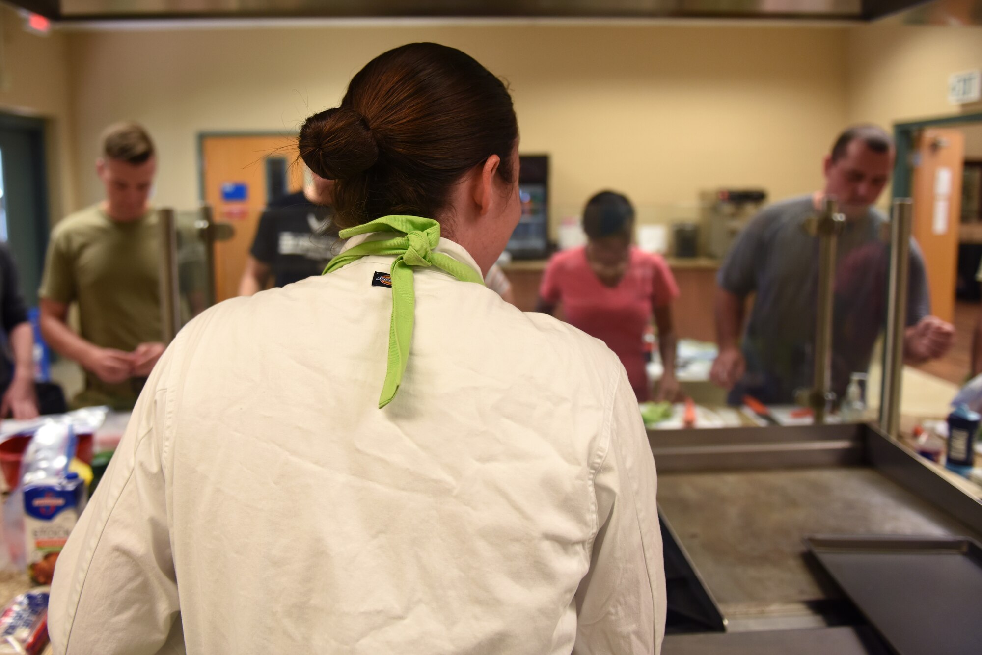 U.S. Air Force Staff Sgt. Roz Beeston, Second Air Force enlisted aid, teaches cooking techniques at the Dorm to Gourmet cooking class inside the McBride Commons on Keesler Air Force Base, Sept. 5, 2019. The cooking class was held to not only improve the cooking skills of Airmen but to build team connection and resiliency. (U.S. Air Force photo by Airman Seth Haddix)