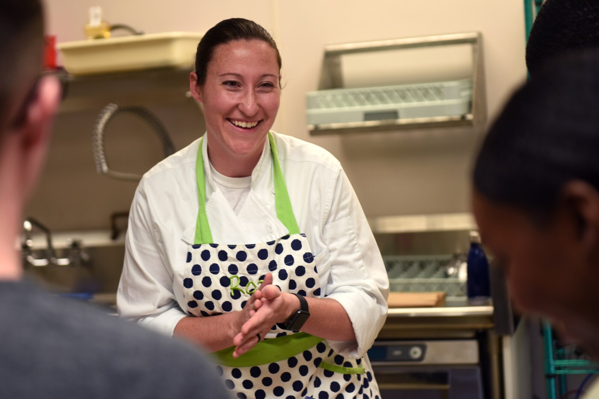 U.S. Air Force Staff Sgt. Roz Beeston, Second Air Force enlisted aid, teaches cooking techniques at the Dorm to Gourmet cooking class inside the McBride Commons on Keesler Air Force Base, Sept. 5, 2019. The cooking class was held to not only improve the cooking skills of Airmen but to build team connection and resiliency. (U.S. Air Force photo by Airman Seth Haddix)