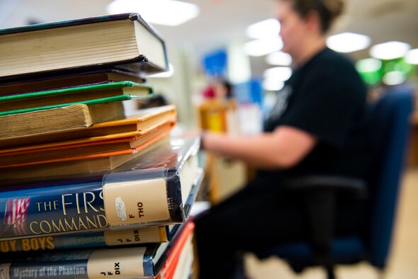 Katrina True, 23d Force Support Squadron library aid, prepares books for return Sept. 6, 2019, at Moody Air Force Base, Ga. With more than 10k books available at the library, it’s just one of the many benefits at the Information Learning Center available to Airmen and families. (U.S. Air Force photo by Senior Airman Erick Requadt)