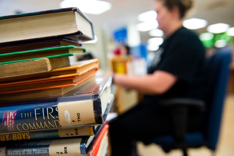 Katrina True, 23d Force Support Squadron library aid, prepares books for return Sept. 6, 2019, at Moody Air Force Base, Ga. With more than 10k books available at the library, it’s just one of the many benefits at the Information Learning Center available to Airmen and families. (U.S. Air Force photo by Senior Airman Erick Requadt)