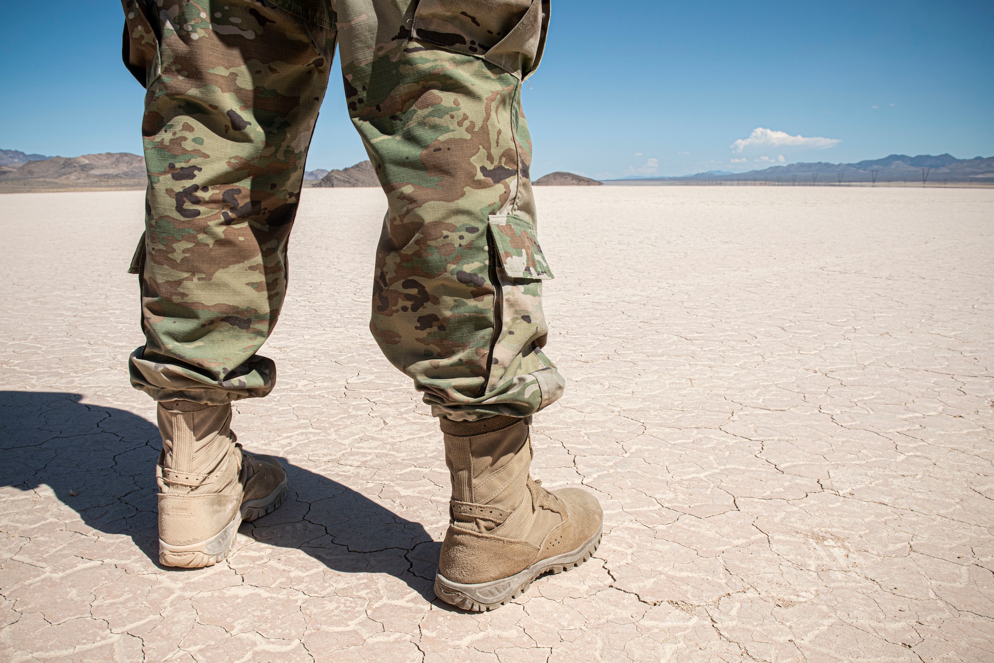 An Airman stands in the middle of the Nevada Test and Training Range (NTTR), August 29, 2019. The NTTR is a desolate area where the United States Air Force can train in an isolated environment.