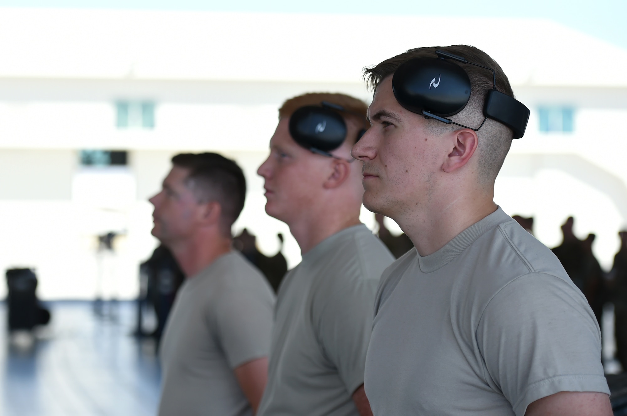 432nd Maintenance Group weapons Airmen stand at parade rest prior to a load competition, at Creech Air Force Base, Nevada, July 19, 2019. The competition consists of uniform and tool kit inspections, a 25-question written test and a specific weapons configuration for them to carry out. (U.S. Air Force photo by Airman 1st Class William Rio Rosado)