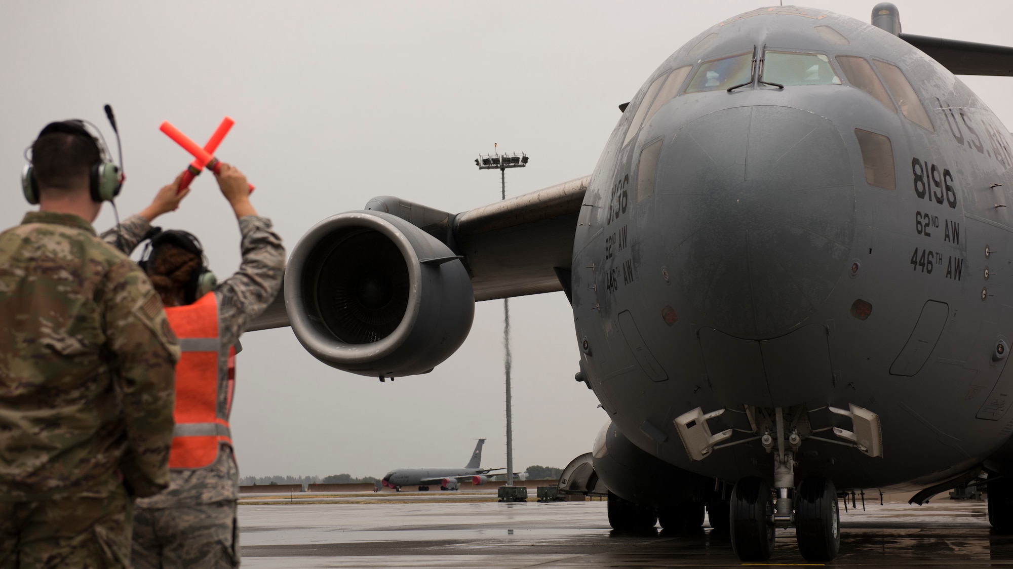 Senior Airman Ciana Jones, 62nd Maintenance Squadron crew chief, directs a C-17 Globemaster to a parking spot at the start of Air Mobility Command’s Mobility Guardian 2019 exercise at Fairchild Air Force Base, Washington, Sept. 8, 2019. Exercise Mobility Guardian is AMC’s premier, large-scale mobility exercise during which more than 2,500 Air Mobility Airmen will participate. (U.S. Air Force photo by Senior Airman Ryan Lackey)