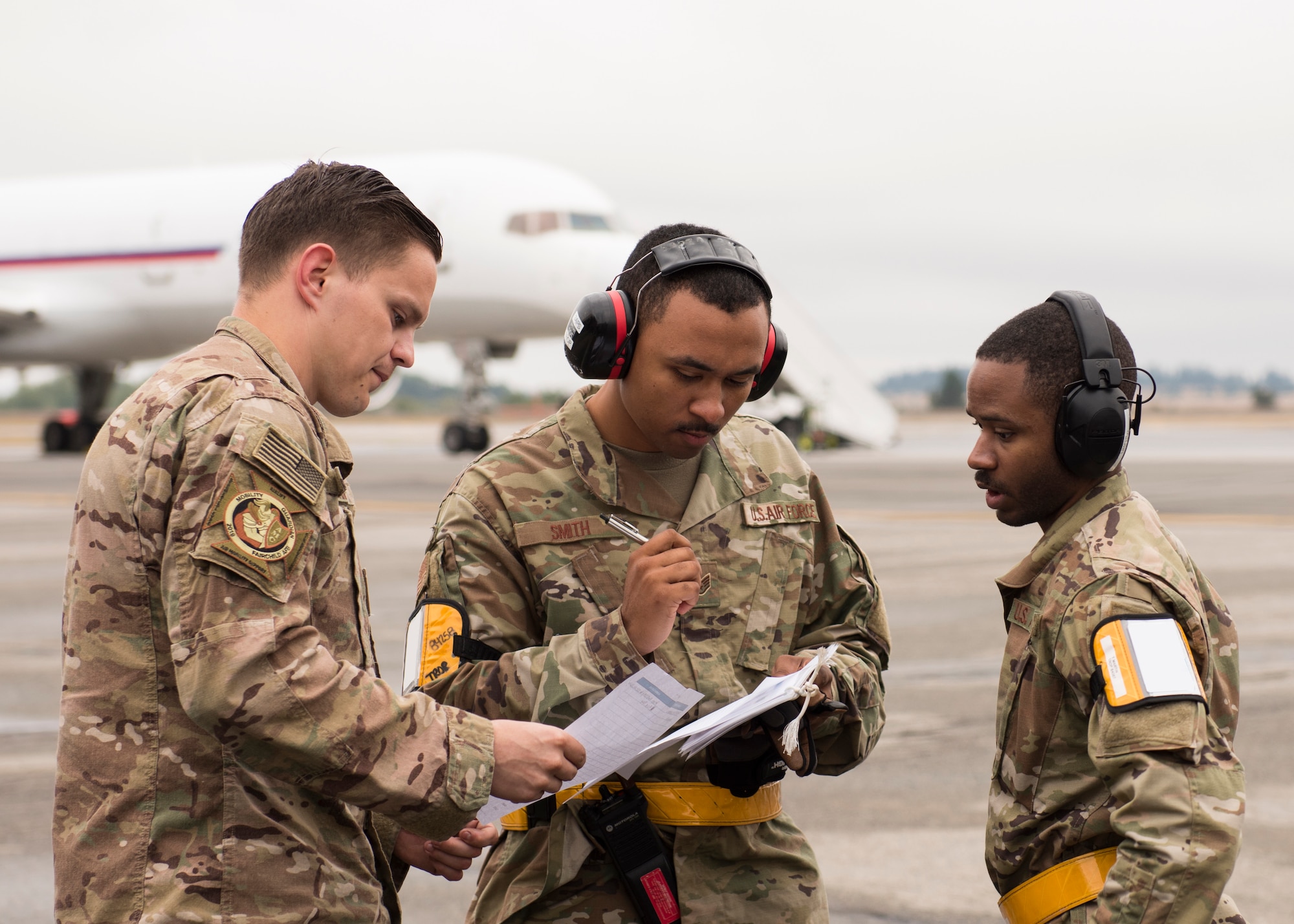 Logistics Airmen from the 43rd Air Mobility Operations Group, Pope Army Airfield, North Carolina, compare cargo manifests on the first day of Air Mobility Command’s Mobility Guardian 2019 exercise at Fairchild Air Force Base, Washington, Sept. 8, 2019. Exercise Mobility Guardian is AMCs premier, large-scale mobility exercise during which more than 2,500 Air Mobility Airmen will participate. (U.S. Air Force photo by Senior Airman Ryan Lackey) (Badge details removed in post-processing for operational safety and security)