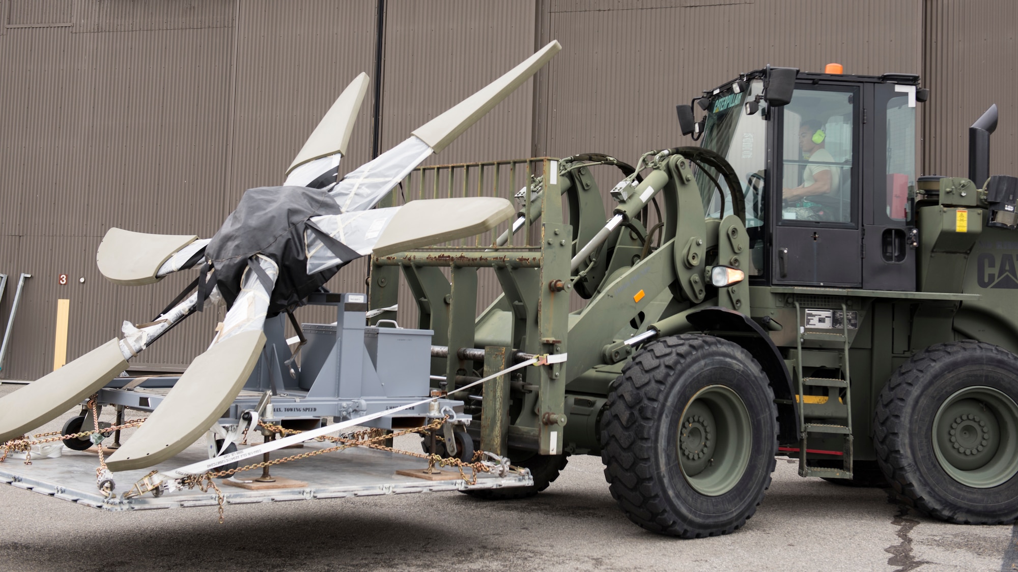 A logistics Airman from Pope Army Airfield, North Carolina, unloads and stores a cargo pallet on the first day of Air Mobility Command’s Mobility Guardian 2019 exercise at Fairchild Air Force Base, Washington, Sept. 8, 2019. Through robust and relevant training, Mobility Guardian is designed to build full spectrum readiness and develop Air Mobility Airmen to deliver rapid global mobility now and in the future. (U.S. Air Force photo by Senior Airman Ryan Lackey)