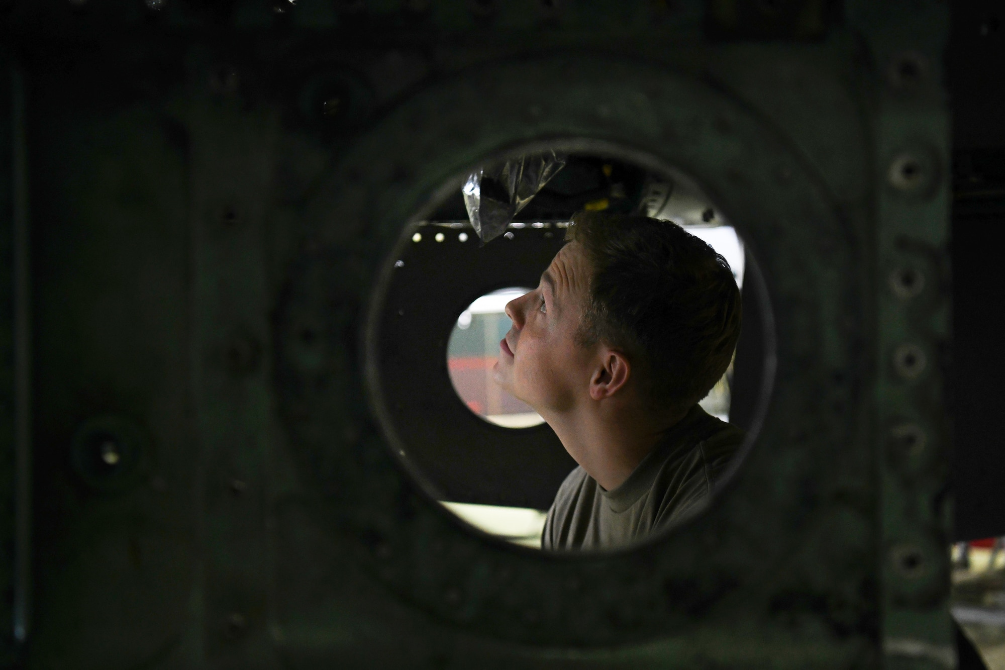 A crew chief assigned to the 48th Equipment Maintenance Squadron inspects an F-15 during a phase inspection at Royal Air Force Lakenheath, England, Aug. 13, 2019. The 48th EMS recently won the Innovation and Transformation Council award for developing and implementing a training and inspection readiness tool called “The Bird Book”. (U.S. Air Force photo by Airman 1st Class Shanice Williams-Jones)
