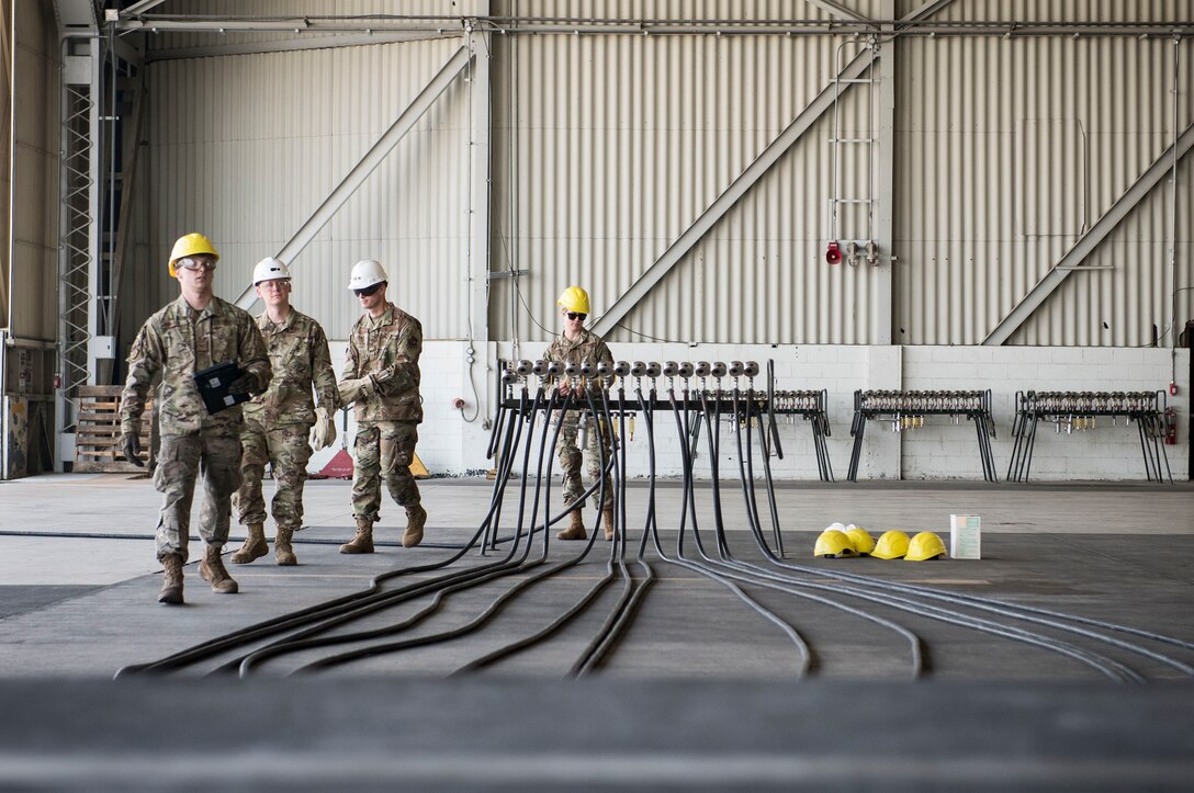 U.S. Air Force Staff Sgt. Andrew Johnson, 39th Maintenance Squadron transient alert crash and recovery team member, showcases newly acquired pneumatic lifting bags during a 39th MXS immersion tour Sept. 5, 2019, at Incirlik Air Base, Turkey. The bags provide the team with greater flexibility to lift and stabilize various aircraft including fighters and cargo aircraft. (U.S. Air Force photo by Staff Sgt. Ceaira Tinsley)