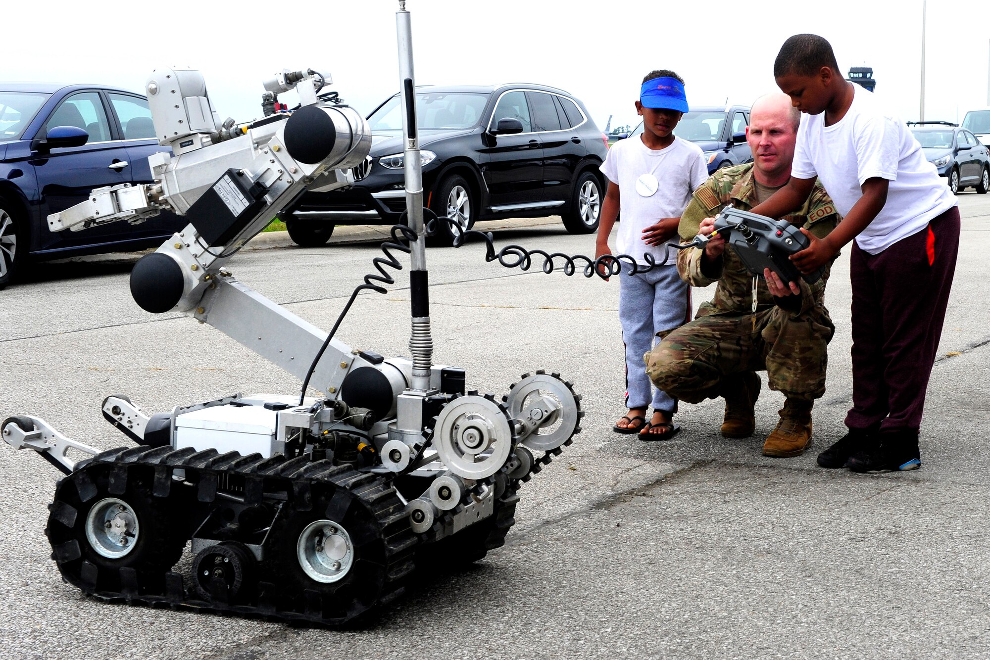 Tech. Sgt. Timothy Baker, 434th Air Refueling Wing Civil Engineer explosive ordnance disposal technician, gives children from the Make-A-Wish foundation a chance at the controls of a robot from his shop, Sept. 6, 2019.  Four children from the Ohio, Kentucky and Indiana region of the organization came to Grissom to spend time with the Thunderbirds ahead of the Grissom Air and Space Expo Sept. 7-8, 2019.
