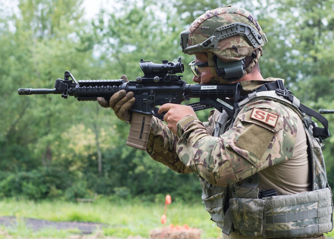 Senior Airman Emilio Masella, 103rd Security Forces Squadron, aims at a target during a range event at the Connecticut SWAT Challenge in Simsbury, Conn. Aug. 14, 2019. The competition brings together tactical operators from across the nation and beyond to practice SWAT weapons tactics, movements and physical fitness. (U.S. Air National Guard photo by Staff Sgt. Steven Tucker)