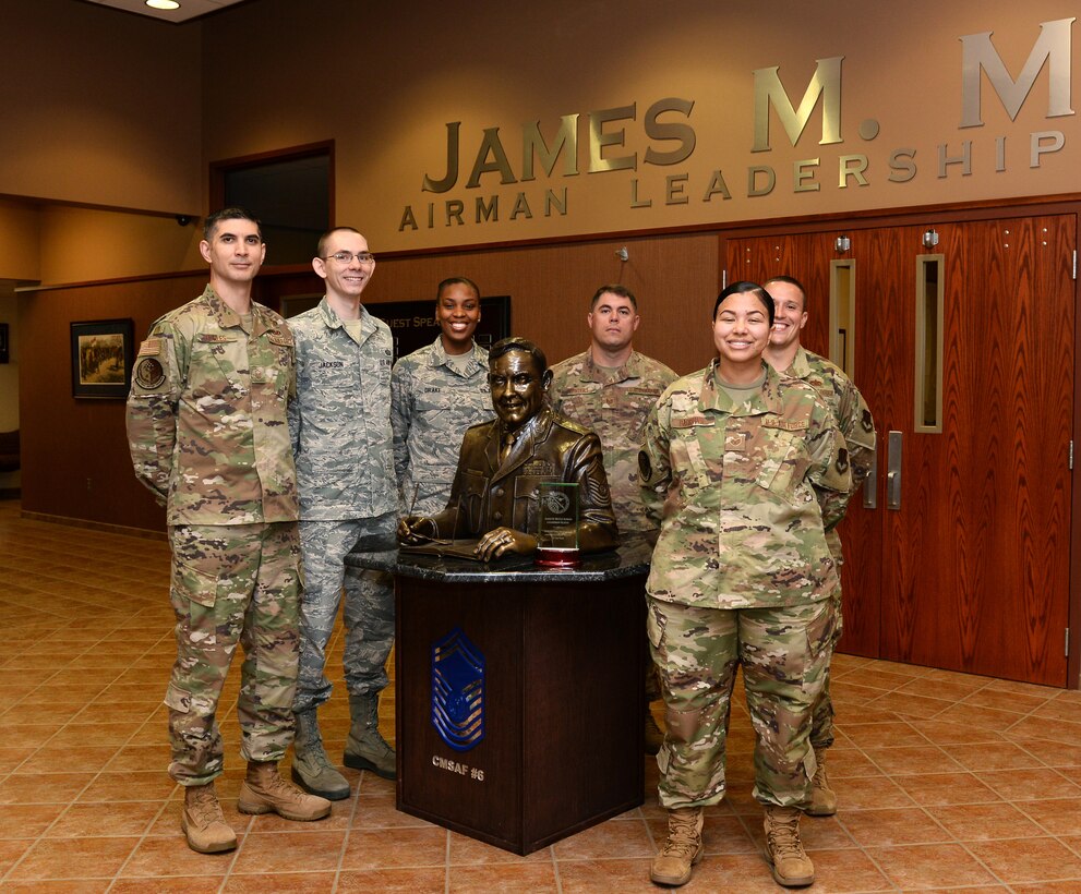The James M. McCoy Airman Leadership School commandant and instructors pose for a photo after receiving the 2018 ALS of the Year award at Offutt Air Force Base, Nebraska Sept. 5, 2019. The primary mission of ALS is to prepare senior airmen for supervisory duties and leadership roles in supporting the employment of air, space and cyberspace capabilities as NCOs. (U.S. Air Force photo by Charles J. Haymond)