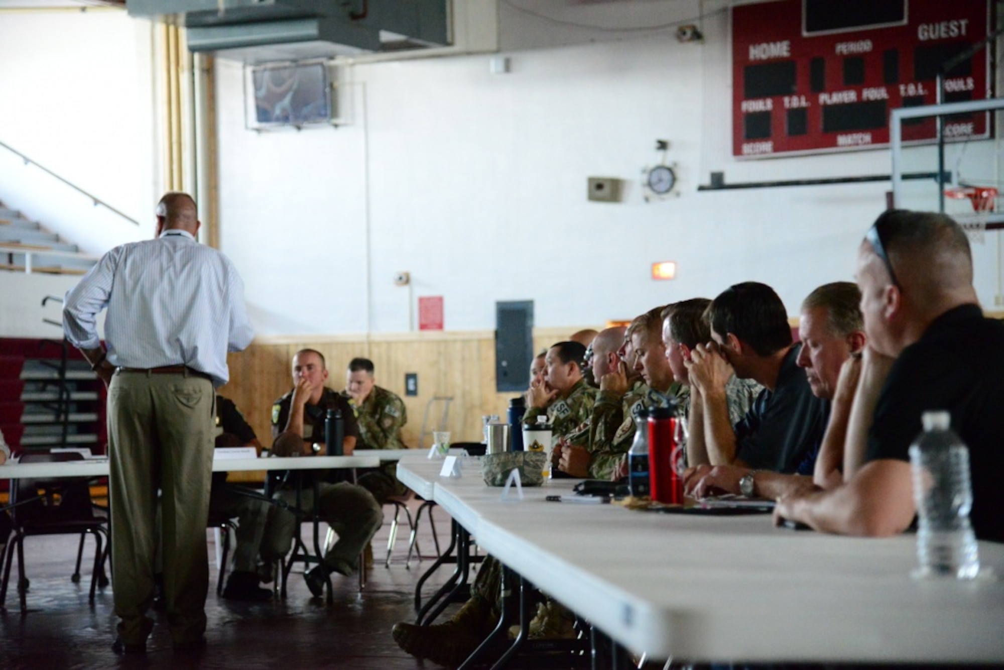Community leaders group together during Local Integrated Response Plan community demonstrations to discuss plans for an exercise Aug. 14, 2018, at Fort Benton, Mont. LIRP is a combined effort between local agencies such as law enforcement and volunteer departments with nearby military organizations. (U.S. Air Force photo by Airman 1st Class Tristan Truesdell)