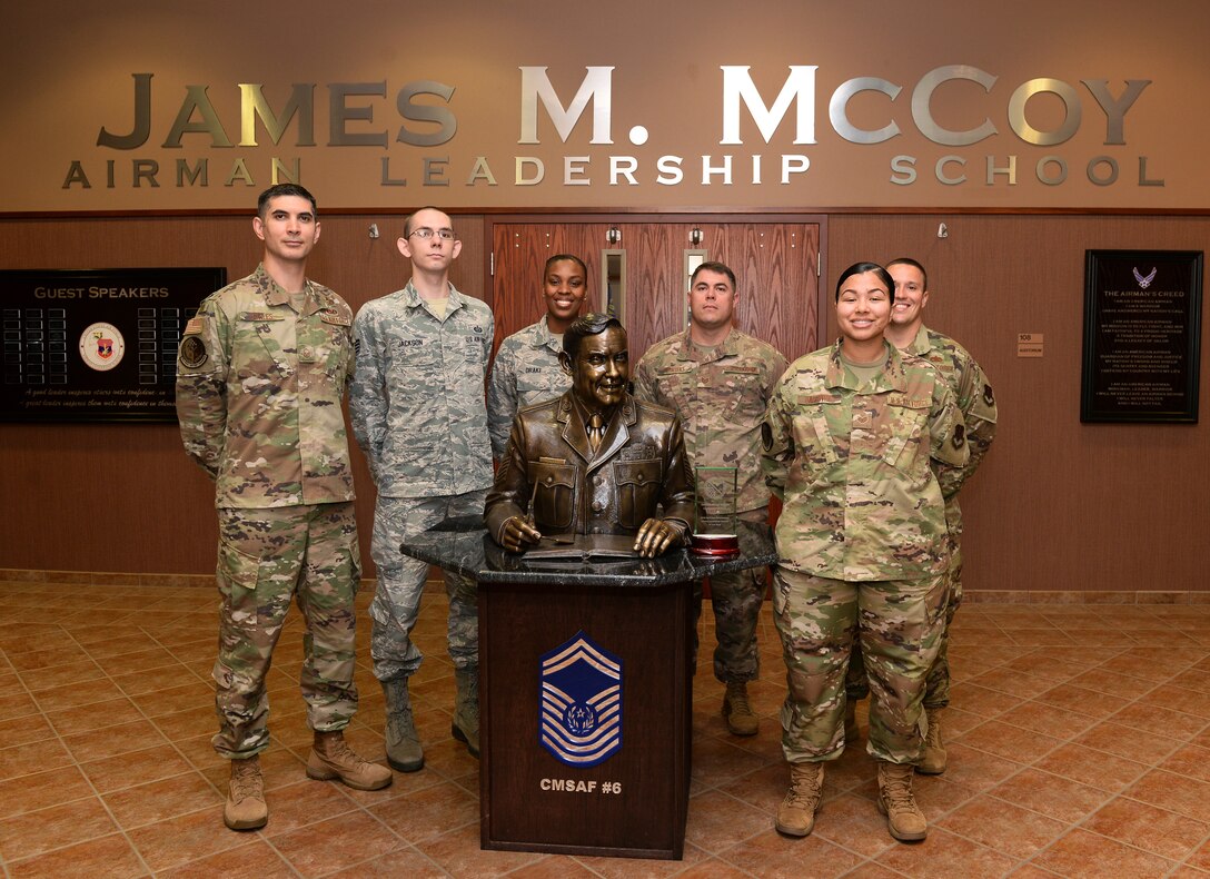 The James M. McCoy Airman Leadership School commandant and instructors pose for a photo after receiving the 2018 ALS of the Year award at Offutt Air Force Base, Nebraska Sept. 5, 2019. The primary mission of ALS is to prepare senior airmen for supervisory duties and leadership roles in supporting the employment of air, space and cyberspace capabilities as NCOs. (U.S. Air Force photo by Charles J. Haymond)