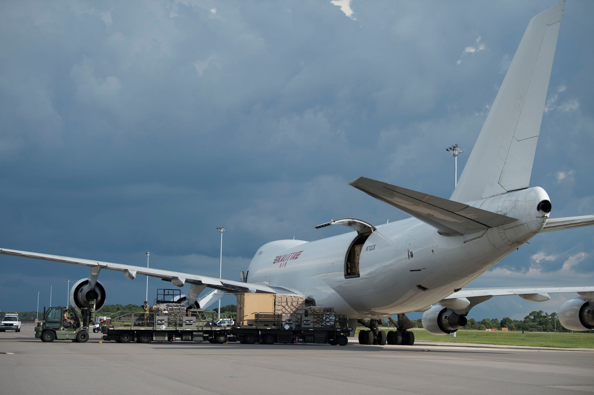 Members of the 6th Logistics Readiness Squadron remove pallets and crates of cargo from a Boeing 747 at MacDill Air Force Base, Fla., July 31, 2019. The team removed 32 increments of cargo which weighed a total of 144,470 pounds of Joint Communications Support Element’s deployed equipment. (U.S. Air Force photo by Senior Airman Adam R. Shanks)