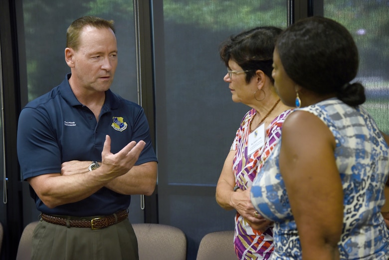 Col. Paul Filcek, 72nd Air Base Wing and Tinker installation commander, speaks with Juanita Ceile and Selonda Moseley, suicide prevention coordinators with the Oklahoma City VA Medical Center, during a Mental Wellness Community Dinner Sept. 4, 2019, at the Midwest City Chamber of Commerce. Members of Team Tinker came together with members of community helping agencies to share information and ideas on suicide prevention.
