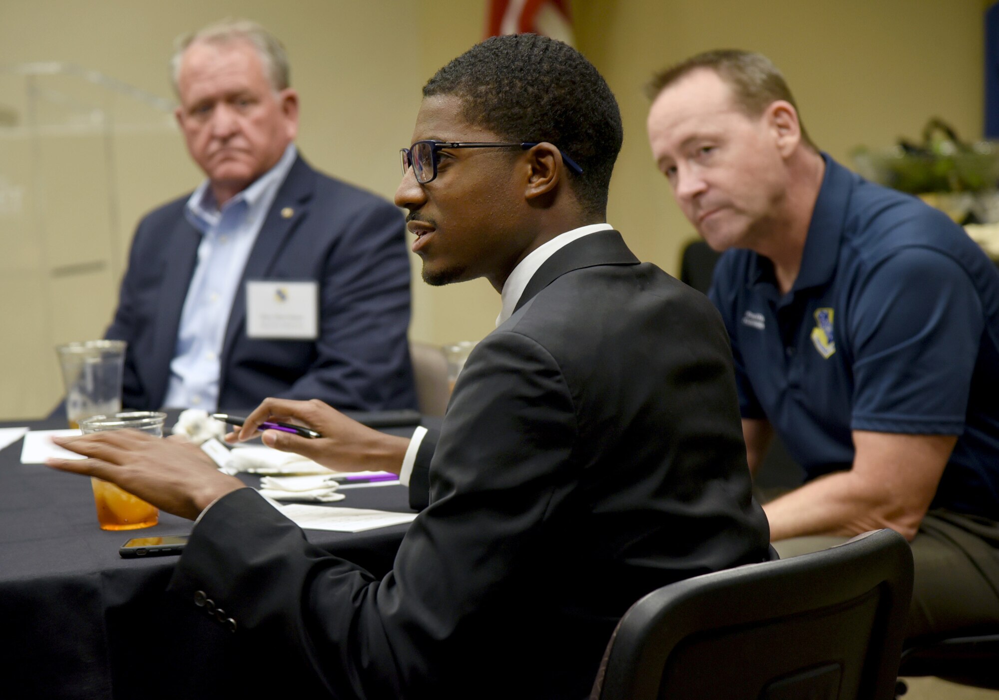 J.D. Baker, special assistant to the Oklahoma City mayor, shares his personal experience of battling depression as a person with bipolar disorder during a Mental Wellness Community Dinner Sept. 4, 2019, at the Midwest City Chamber of Commerce. Listening are, Midwest City Mayor Matt Dukes, left, and 72nd Air Base Wing and Tinker Installation Commander Col. Paul Filcek. Members of Team Tinker had the opportunity to listen to ideas and share their own experiences with community members specializing in mental wellness, substance abuse, and suicide prevention during the event.