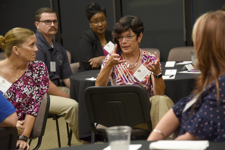 Juanita Ceile, a suicide prevention coordinator with the Oklahoma City VA Medical Center, shares her thoughts during a Mental Wellness Community Dinner Sept. 4, 2019, at the Midwest City Chamber of Commerce. Ceile was among the community members from various helping agencies who sat down with members of Team Tinker to share information and ideas on suicide prevention.