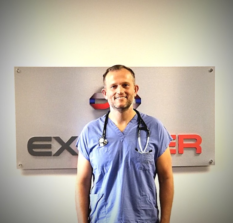 Dr. Nathaniel Ott, an Air Force Reserve instructor in Air University’s LeMay Center Joint Integration directorate, stands in his scrubs at his civilian-capacity career as an ER physician in Odessa, Texas. Ott was on-scene during a mass-shooting incident in Odessa on Aug. 31, 2019, and provided life-saving first-aid to a victim who had sustained three gunshot wounds while in her vehicle.