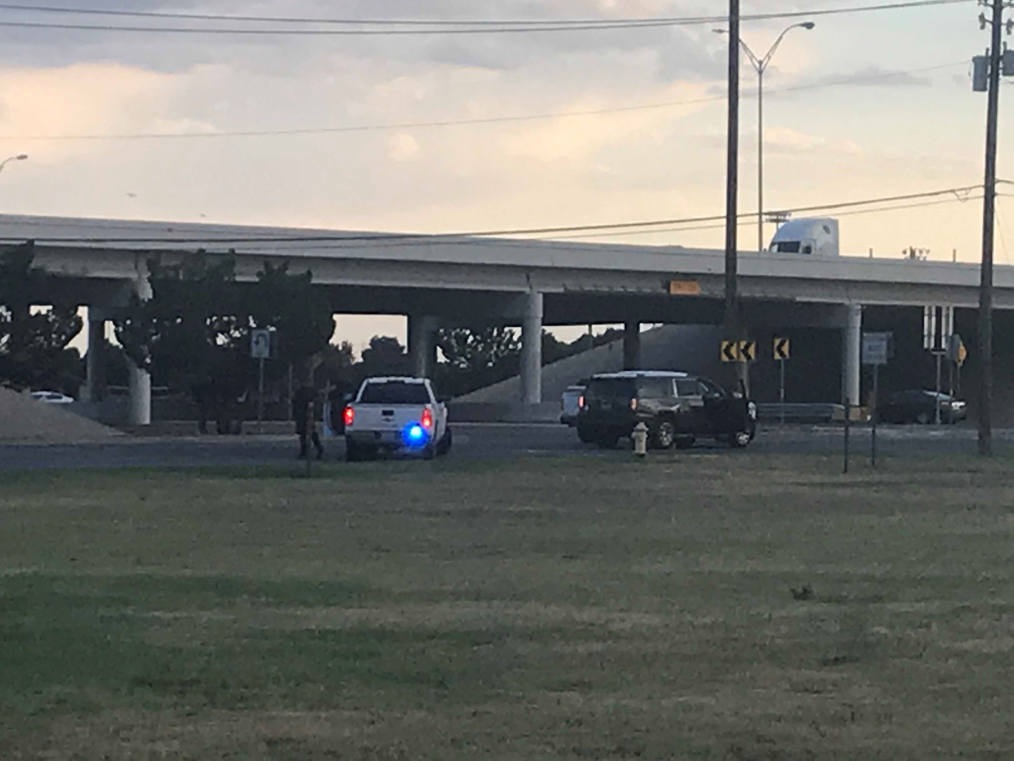 A police cruiser and civilian vehicle sit at an intersection following a mass shooting incident in which the civilian driver sustained three gunshot wounds Aug. 31, 2019, in Odessa, Texas. Dr. Nathaniel Ott, an Air Force Reserve instructor in Air University’s LeMay Center Joint Integration directorate, rushed out to the scene after hearing the shots from outside the ER in which he works in his civilian-capacity career. He worked with an officer and paramedic to turn a police cruiser into an impromptu ambulance to transport the victim to a nearby trauma center for treatment.